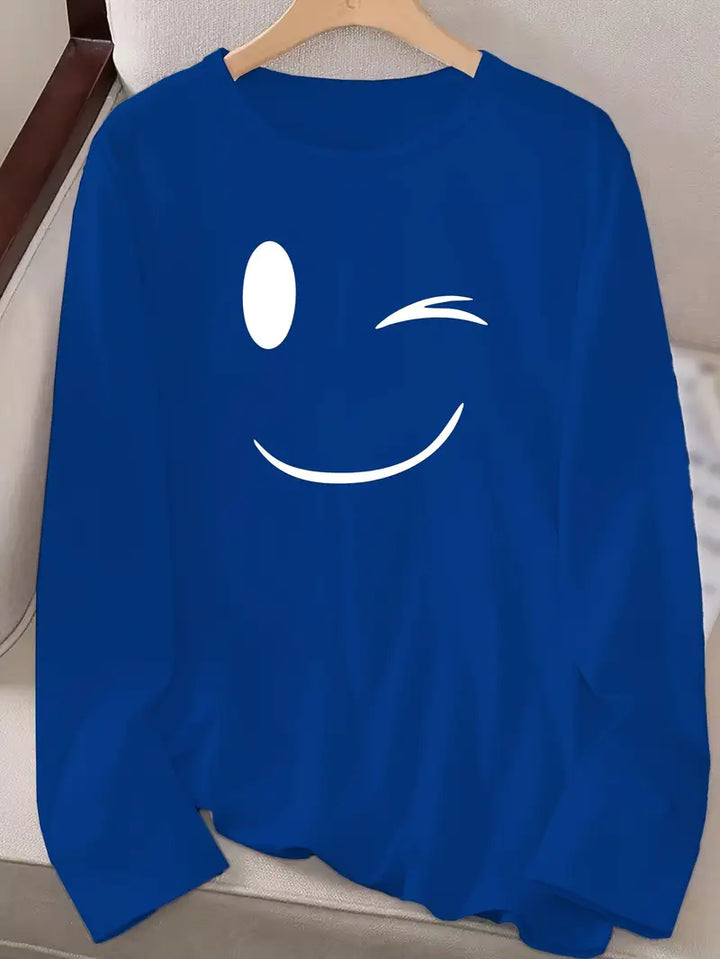 Odalina - カジュアルなスマイルウィンクプリントTシャツ